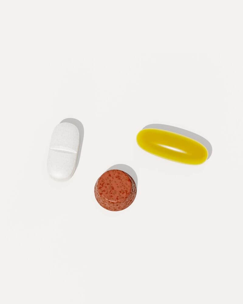 Three different colored pills